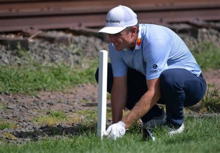 Can I stand on my putting line?