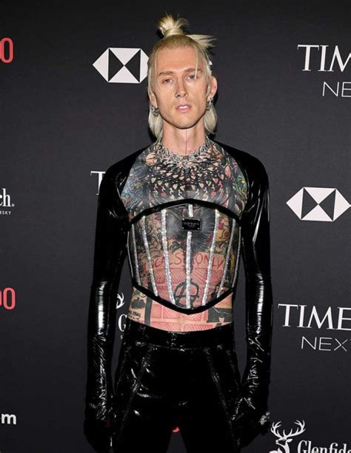 How did Machine Gun Kelly meet Travis Barker?