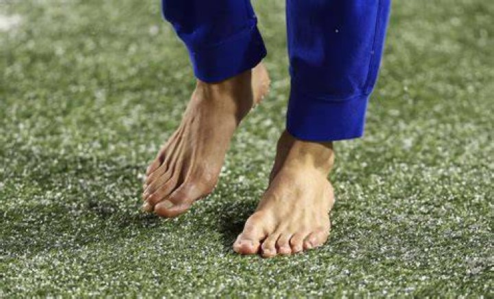 What NFL player kicked barefoot?