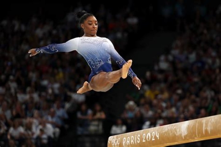 Who replaces Simone Biles on uneven bars?