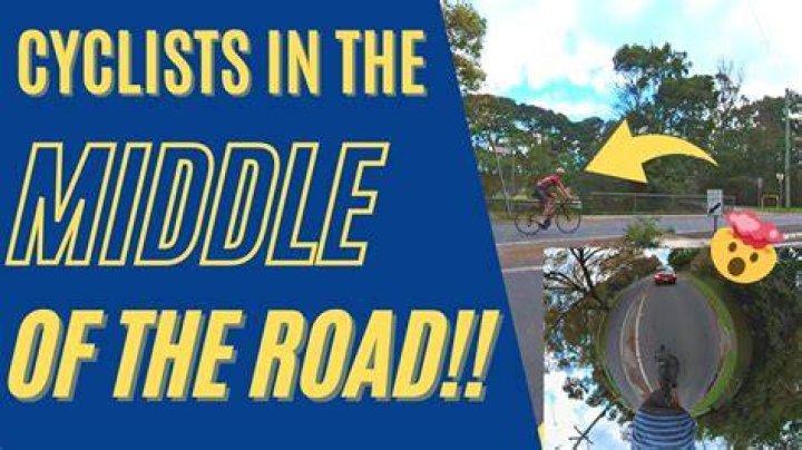 Why do cyclists ride in the middle of the road?