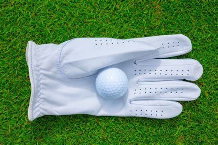 Why do golfers wear a golf glove?