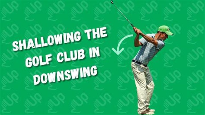 Why do I stand up in my downswing?