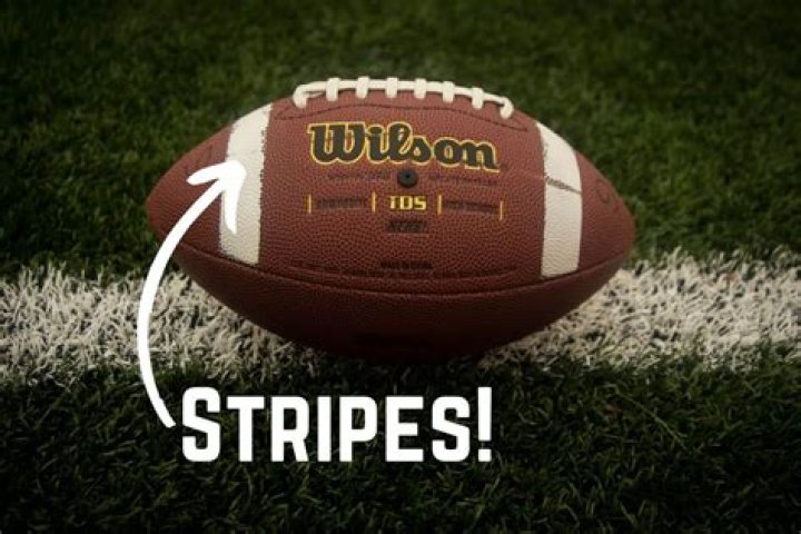 Why do some footballs have white stripes?
