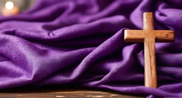 Why do they put purple on the cross?